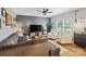 Comfortable living room featuring a gray sofa, geometric accent wall, and hardwood floors at 2217 Yadkin Ave, Charlotte, NC 28205