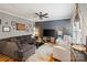 Comfortable living room with a plush sectional sofa, hardwood floors, and a modern entertainment center at 2217 Yadkin Ave, Charlotte, NC 28205