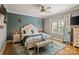 Comfortable main bedroom with a ceiling fan, a decorative rug, and natural light at 2217 Yadkin Ave, Charlotte, NC 28205