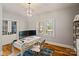 Stylish home office featuring hardwood floors, natural light, and modern desk setup at 2217 Yadkin Ave, Charlotte, NC 28205