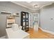 Well-lit office space featuring a sewing station, cabinet, and hardwood floors at 2217 Yadkin Ave, Charlotte, NC 28205