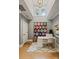 Bright office space featuring hardwood floors, a quilt, and a modern white desk at 2217 Yadkin Ave, Charlotte, NC 28205