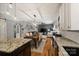 Spacious open concept with hardwood floors, featuring a kitchen island, dining area, and living room at 2217 Yadkin Ave, Charlotte, NC 28205