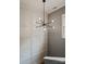 Stairwell with unique lighting fixture and wainscoting walls at 2217 Yadkin Ave, Charlotte, NC 28205
