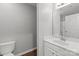 Bathroom featuring a toilet, modern vanity, and a sleek sink with modern faucet at 252 Sweet Bay Nw Ln, Concord, NC 28027