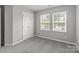 Inviting bedroom with abundant natural light from large windows at 252 Sweet Bay Nw Ln, Concord, NC 28027