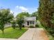 Charming home with gray siding, a well-manicured lawn, and a long driveway at 252 Sweet Bay Nw Ln, Concord, NC 28027