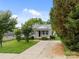 A charming house boasts gray siding, lush front yard, and a concrete driveway at 252 Sweet Bay Nw Ln, Concord, NC 28027