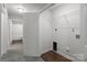 Practical laundry room with overhead shelving and easy access, enhancing home convenience at 252 Sweet Bay Nw Ln, Concord, NC 28027