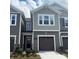 Charming townhome with a well-manicured lawn and a one-car garage at 300 Laura Elizabeth Ln, Clover, SC 29710