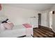 Bedroom with white furniture, hardwood flooring, and a comfortable setting at 3009 Lydney Cir, Waxhaw, NC 28173