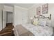 Cozy bedroom featuring a floral quilt, accent pillows and views of the hall at 3009 Lydney Cir, Waxhaw, NC 28173