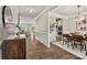 Open entryway leading to the dining room and living area with hardwood floors at 3009 Lydney Cir, Waxhaw, NC 28173