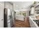 Modern kitchen with stainless steel appliances, white cabinets, and an island with pendant lighting at 3009 Lydney Cir, Waxhaw, NC 28173