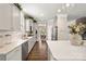 Bright kitchen featuring white cabinets, quartz countertops, and stainless steel appliances at 3009 Lydney Cir, Waxhaw, NC 28173