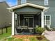 Covered patio with comfortable seating, ideal for outdoor relaxation and entertaining at 3009 Lydney Cir, Waxhaw, NC 28173