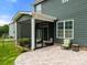 Brick patio with a screened in porch and plenty of room to enjoy the outdoors at 3009 Lydney Cir, Waxhaw, NC 28173