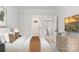 Comfortable bedroom featuring natural light, warm accents and connected living space at 3034 Finchborough Ct # 233, Charlotte, NC 28269