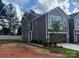 Charming two-story home with gray siding, inviting curb appeal, and attached garage at 304 Laura Elizabeth Ln, Clover, SC 29710