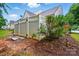 Fenced yard with fresh mulch, a few shrubs, and easy access to the backyard at 3071 Des Prez Ave, Fort Mill, SC 29707