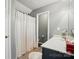 Functional bathroom features a shower-tub combo, white vanity, and gray walls at 3071 Des Prez Ave, Fort Mill, SC 29707