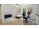 Bright bedroom features neutral walls, ceiling fan, large window, and space for an office setup at 3071 Des Prez Ave, Fort Mill, SC 29707