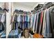 Walk in closet with rods and shelving used for storage of clothing and accessories at 3071 Des Prez Ave, Fort Mill, SC 29707
