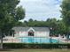 Community pool area surrounded by mature trees and featuring lounge chairs for residents' enjoyment at 3071 Des Prez Ave, Fort Mill, SC 29707