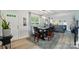 Bright dining room featuring modern lighting, a wooden table, and an open layout at 3071 Des Prez Ave, Fort Mill, SC 29707