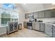 Modern kitchen with stainless steel appliances, ample cabinetry, and a bright window at 3071 Des Prez Ave, Fort Mill, SC 29707