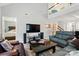 Open-concept living area with a modern TV, comfortable seating, and great natural light at 3071 Des Prez Ave, Fort Mill, SC 29707