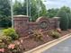 Hanover community entrance featuring a brick sign with decorative lighting and manicured landscaping at 3071 Des Prez Ave, Fort Mill, SC 29707