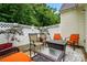 Inviting outdoor patio area features stylish seating, a fire pit, and a well-maintained fence at 3071 Des Prez Ave, Fort Mill, SC 29707
