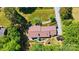 Aerial view of a brick home with a backyard patio and mature trees at 308 Odell St, Kannapolis, NC 28083