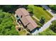 Aerial view of home featuring landscaped backyard, patio, and tree coverage at 308 Odell St, Kannapolis, NC 28083