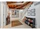 Finished basement area featuring painted block walls, exposed ceiling, and staircase to the upper level at 308 Odell St, Kannapolis, NC 28083