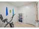 Basement workout area with a stationary bike and shelving for equipment storage at 308 Odell St, Kannapolis, NC 28083