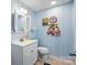 Basement powder room with a modern vanity, toilet, and medicine cabinet at 308 Odell St, Kannapolis, NC 28083