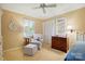 Cozy bedroom featuring neutral tones, natural light, a chair, and closet space at 308 Odell St, Kannapolis, NC 28083