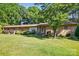 Well-maintained brick home with lush greenery and a welcoming entrance at 308 Odell St, Kannapolis, NC 28083