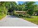 Beautiful brick home featuring manicured landscaping and a paved driveway at 308 Odell St, Kannapolis, NC 28083