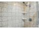 Tiled shower with adjustable shower head and built-in shelving for added convenience at 308 Odell St, Kannapolis, NC 28083