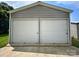 Spacious two-car garage with two large roll-up doors and ample concrete space in front at 329 Highland Dr, Lincolnton, NC 28092