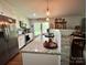 Bright kitchen with stainless steel appliances, granite countertops, a backsplash, and plenty of light at 329 Highland Dr, Lincolnton, NC 28092