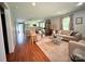 Open-concept living space featuring hardwood floors and seamless transition to other living areas and kitchen at 329 Highland Dr, Lincolnton, NC 28092