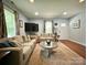 Cozy living room with comfortable sofas, a round coffee table, and a warm, inviting area rug at 329 Highland Dr, Lincolnton, NC 28092