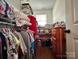 Well-organized walk-in closet with shelving units, hanging racks, and a small window for natural light at 329 Highland Dr, Lincolnton, NC 28092