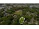 Aerial view of property boundary surrounded by lush greenery in neighborhood near ball field at 3526 Craig Ave, Charlotte, NC 28211