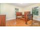 Bright bedroom with hardwood floors and windows at 3526 Craig Ave, Charlotte, NC 28211