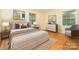Staged bedroom with elegant furniture, neutral tones, and ample natural light at 3526 Craig Ave, Charlotte, NC 28211